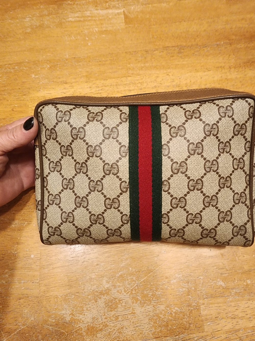 vintage Gucci GG monogram canvas clutch featuring the signature red & green Web